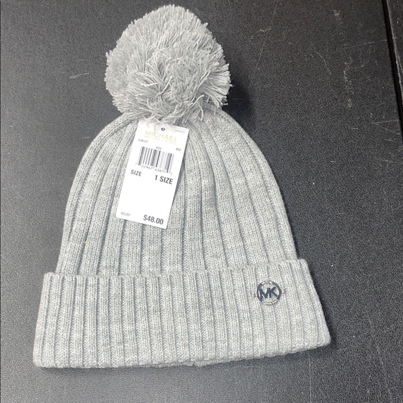 Michael Kors Accessories - NWOT Michael Kors Beanie Cable
Knit Hat Gray Pom Pom Silver..
